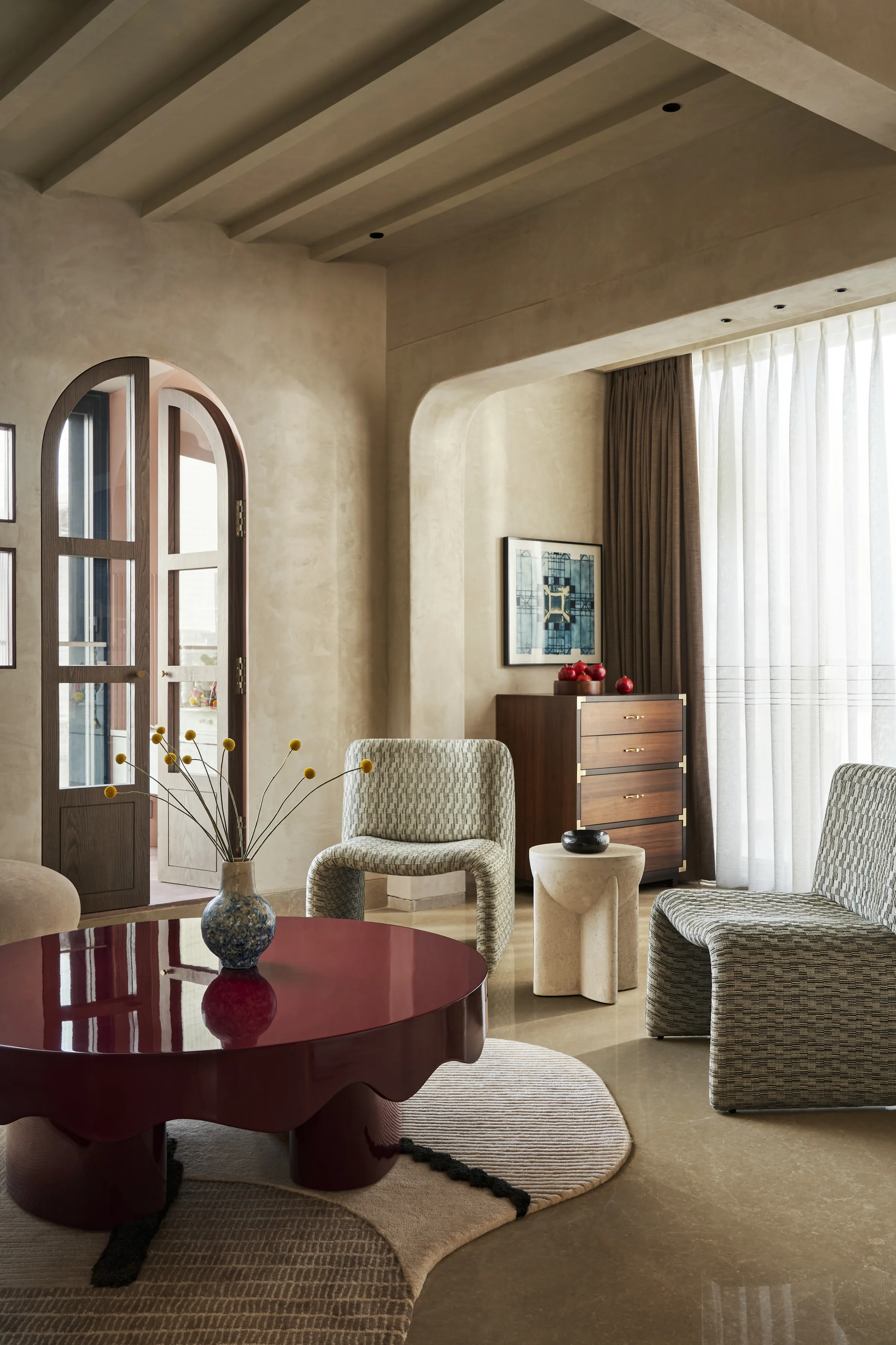 Bombay Design Lab — Melt table in burgundy lacquer with sculptural seating