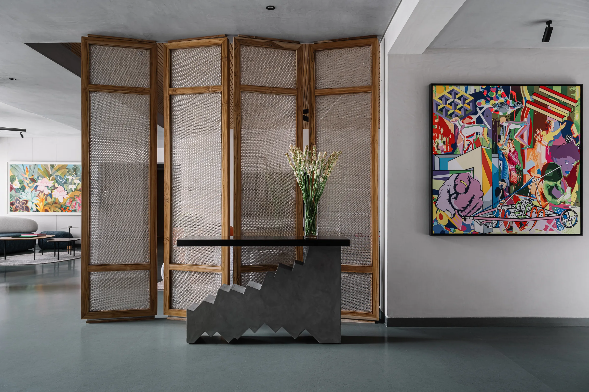 Bombay Design Lab — RISE console with stepped base against cane screens